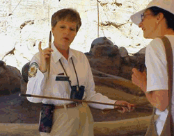 Docent interpreting dinosaur bones